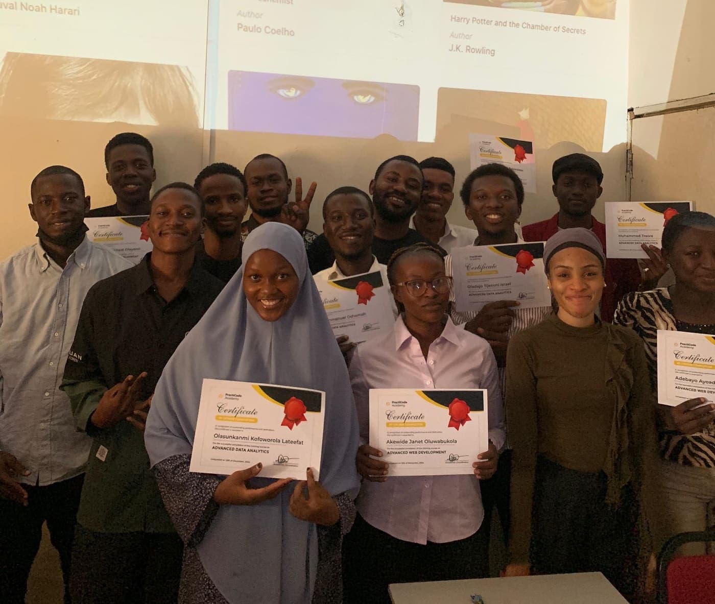 PractiCode Academy students holding their certificates