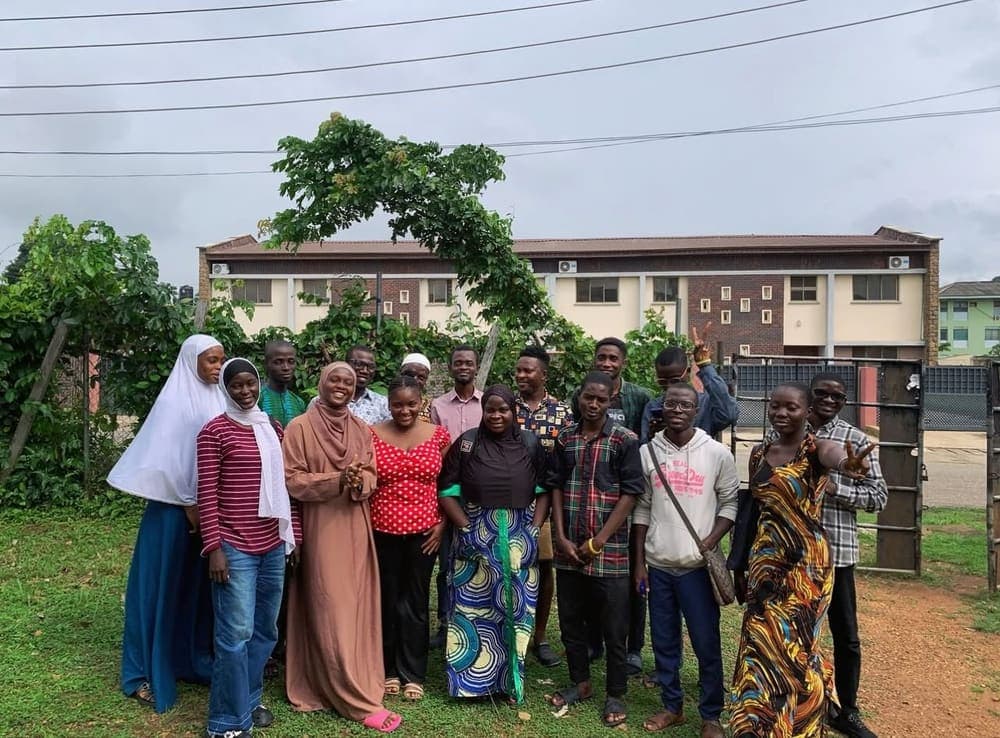 A class photo outdoors in Ibadan