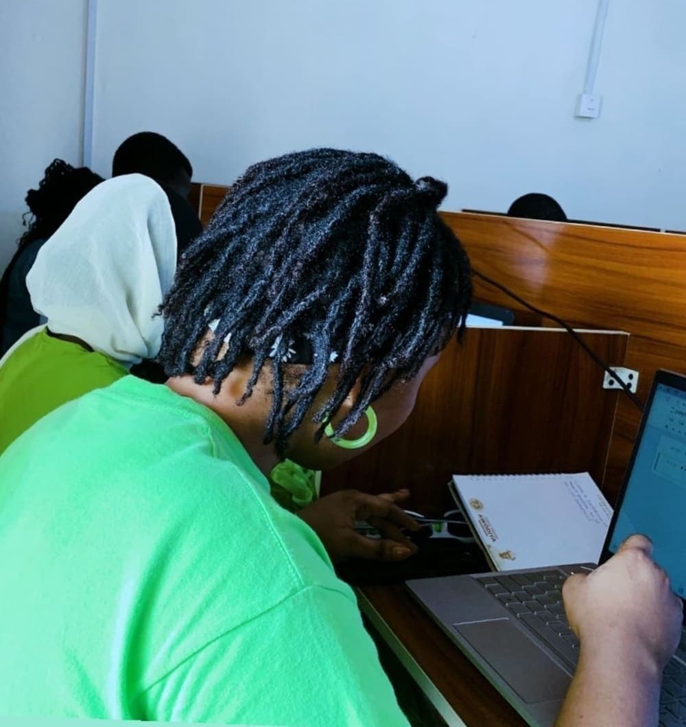 A student writing code during a lesson